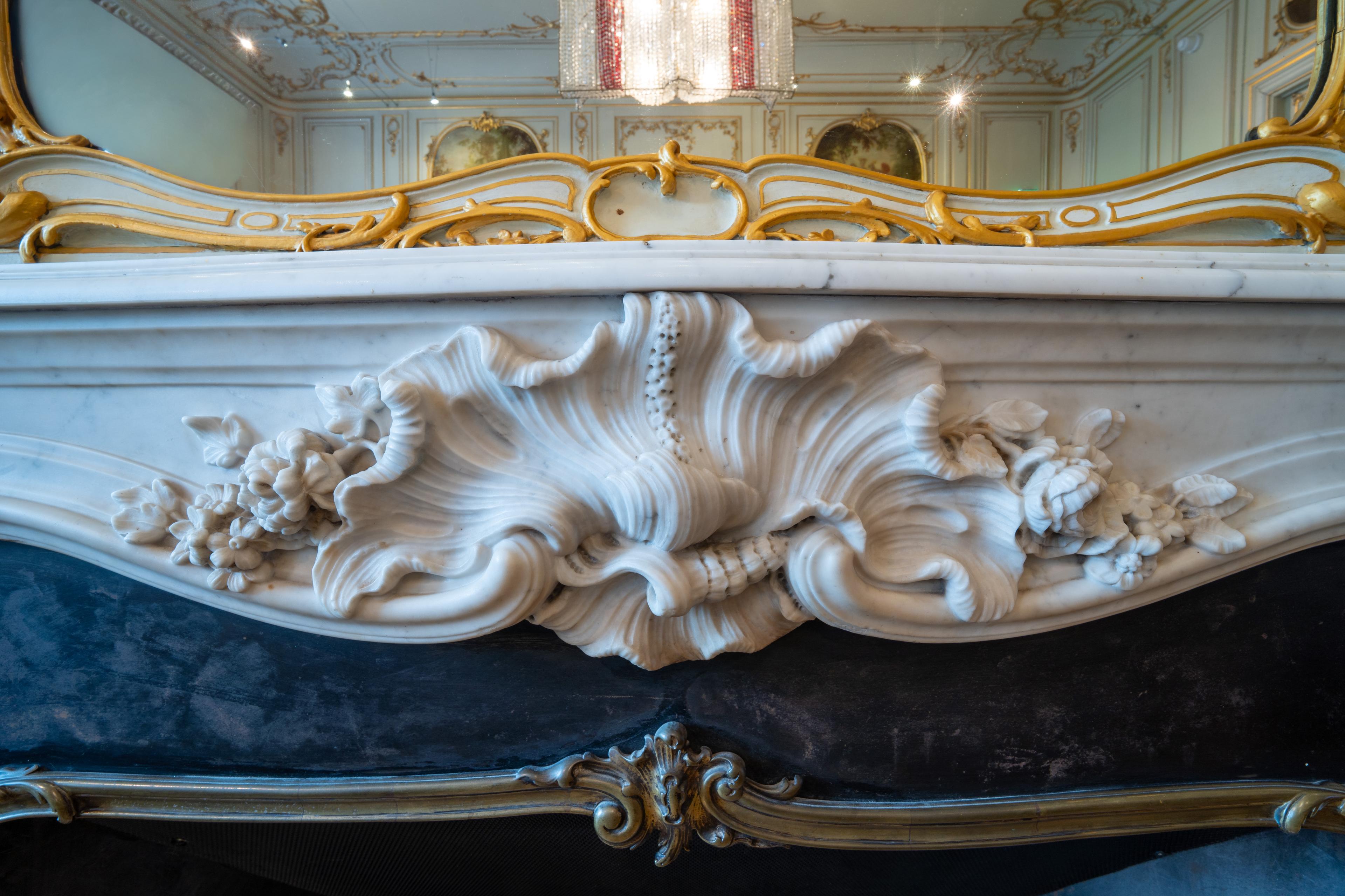 <p>The central Rococo ornament, or rocaille, in the chimneypiece, which was installed in the Palace in 1900 but is itself older. Photo: Cultural Heritage Agency of the Netherlands, Michel Mees 2026</p>